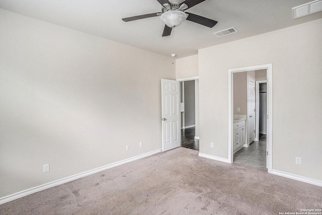 12448 Big Valley Crk, San Antonio, TX 78254 - unfurnished bedroom featuring light colored carpet, baseboards, visible vents, and ensuite bath