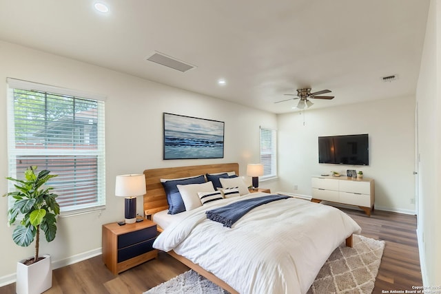 bedroom featuring recessed lighting, baseboards, visible vents, and wood finished floors