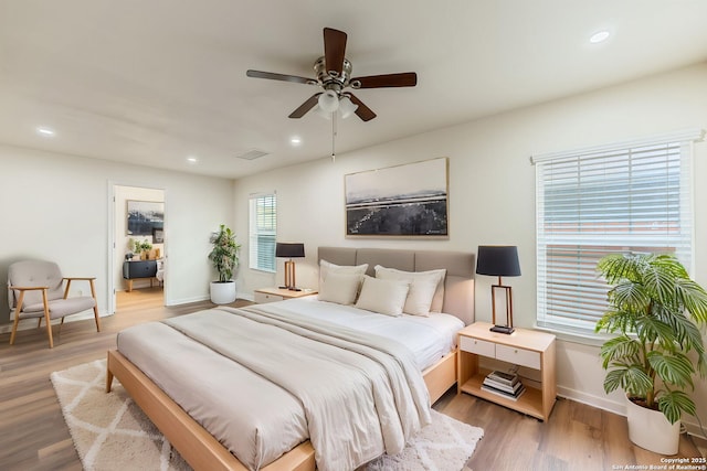 bedroom with visible vents, baseboards, ceiling fan, recessed lighting, and light wood-style flooring