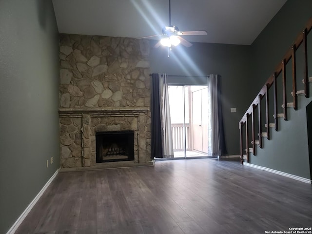 4107 Medical Unit 1204, San Antonio, TX 78229 - unfurnished living room featuring stairway, a fireplace, a ceiling fan, and wood finished floors