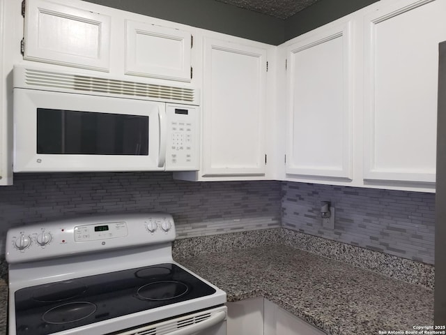 4107 Medical Unit 1204, San Antonio, TX 78229 - kitchen featuring decorative backsplash, stone countertops, white appliances, and white cabinetry