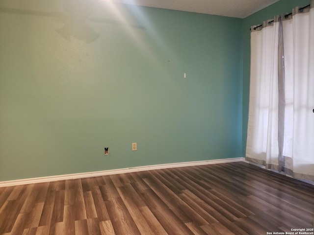 4107 Medical Unit 1204, San Antonio, TX 78229 - unfurnished room with dark wood-style flooring and baseboards