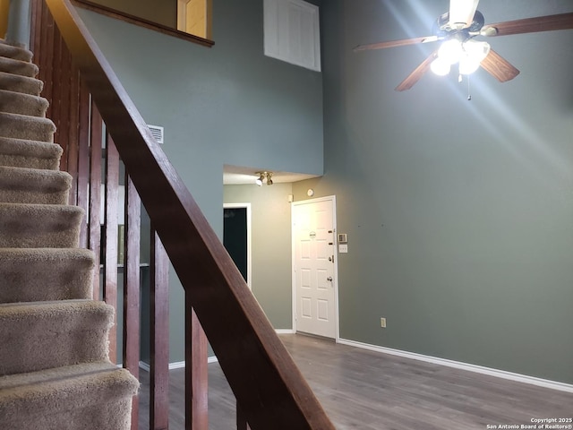4107 Medical Unit 1204, San Antonio, TX 78229 - stairs with ceiling fan, visible vents, wood finished floors, baseboards, and a high ceiling