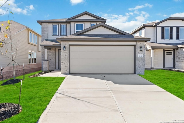 view of front of house featuring a garage, a front lawn, fence, brick siding, and concrete driveway