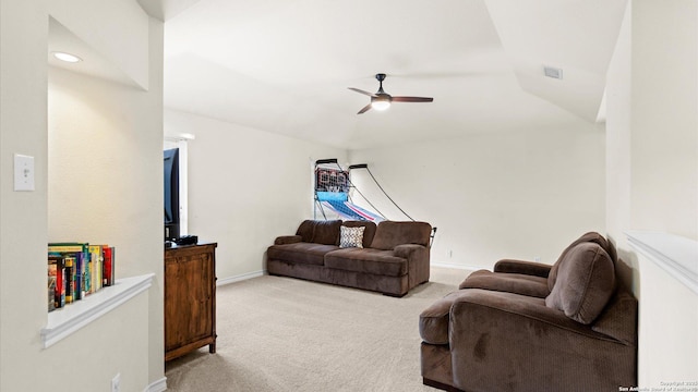 living room featuring ceiling fan, light colored carpet, baseboards, and lofted ceiling
