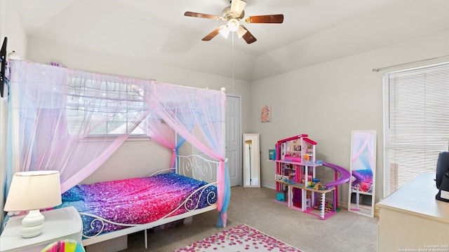 bedroom featuring carpet floors, ceiling fan, and lofted ceiling