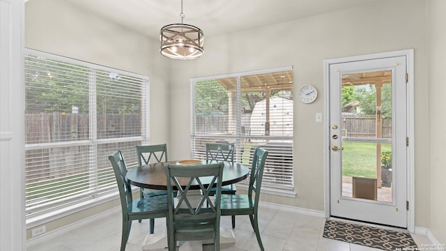 dining area featuring baseboards