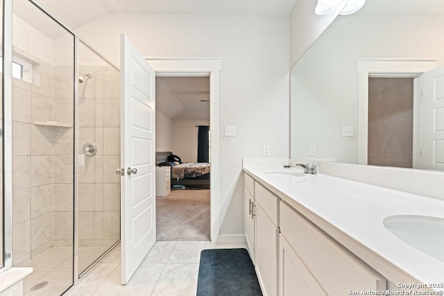 full bath with double vanity, ensuite bath, a sink, and a stall shower