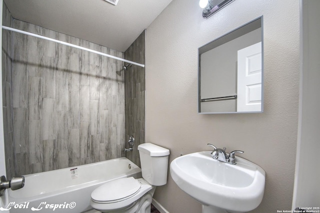 full bathroom with a sink, shower / bathtub combination, and toilet