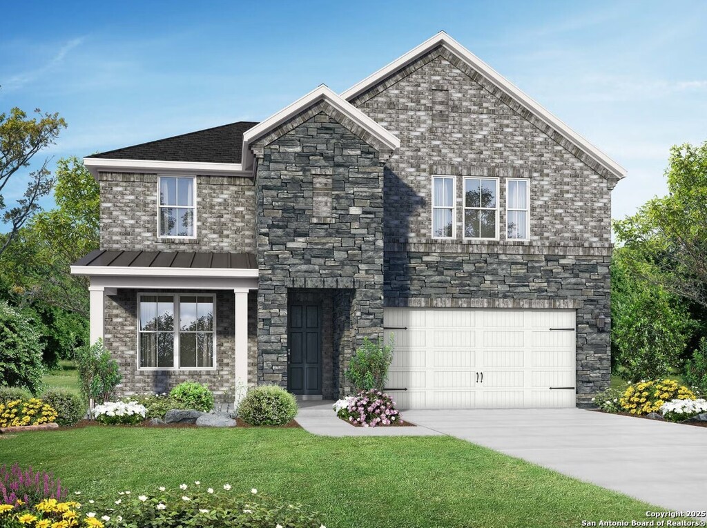 view of front of house with a standing seam roof, driveway, a front lawn, an attached garage, and stone siding