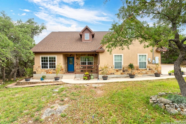 view of front of property with a porch, stucco siding, and stone siding