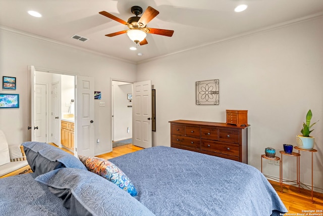 bedroom featuring visible vents, ornamental molding, baseboards, recessed lighting, and light wood-style flooring