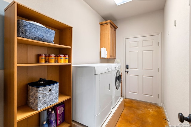 clothes washing area with cabinet space and washing machine and clothes dryer