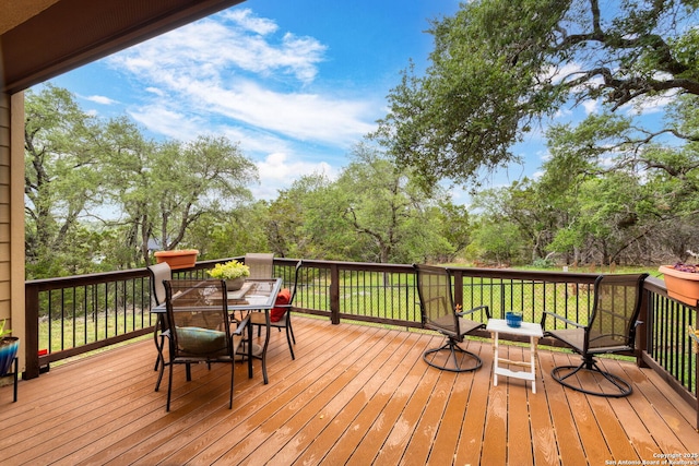 wooden deck with outdoor dining area