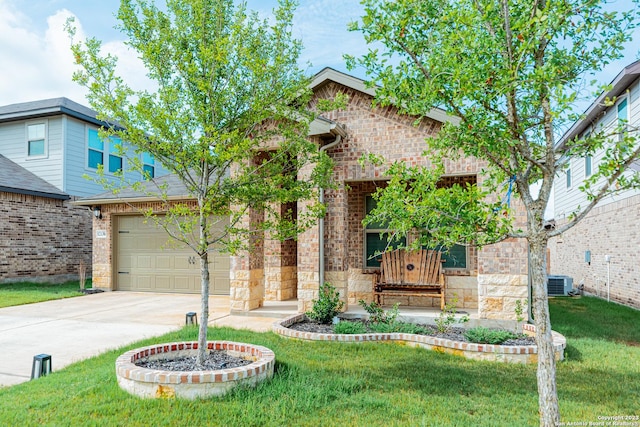 traditional-style house with central air condition unit, concrete driveway, brick siding, and a front yard