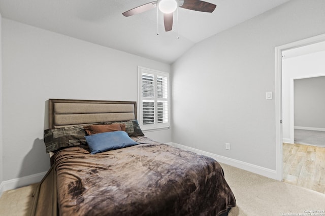 bedroom featuring a ceiling fan, baseboards, and vaulted ceiling