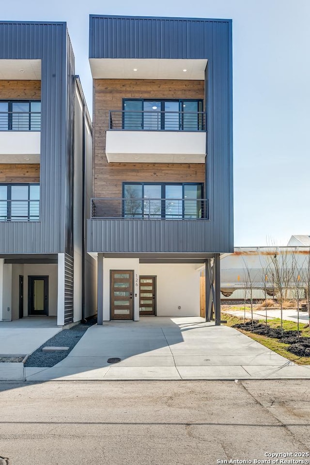 modern home featuring an attached garage and driveway