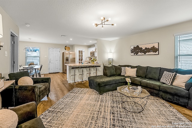 7603 Capstone, San Antonio, TX 78244 - living area featuring recessed lighting, visible vents, plenty of natural light, and light wood-style floors