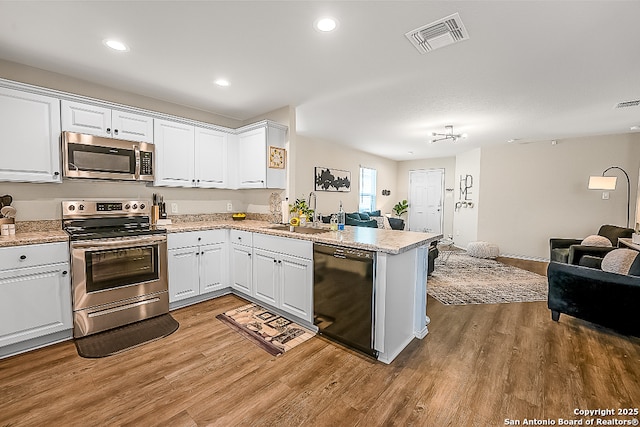7603 Capstone, San Antonio, TX 78244 - kitchen with visible vents, open floor plan, a sink, and appliances with stainless steel finishes