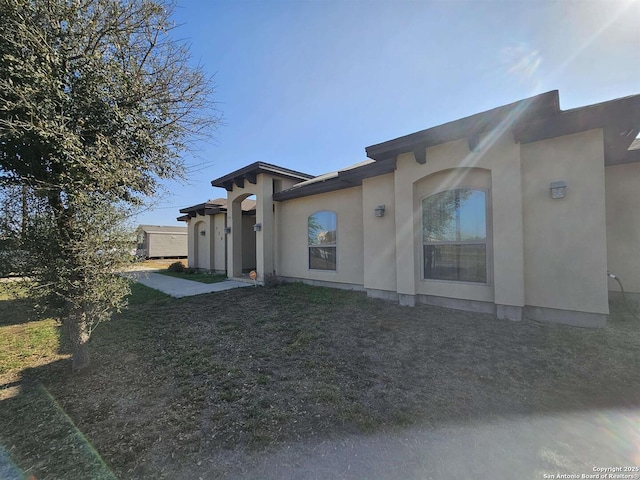 exterior space with stucco siding