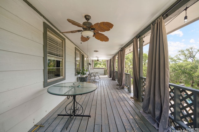 unfurnished sunroom with ceiling fan and a wealth of natural light
