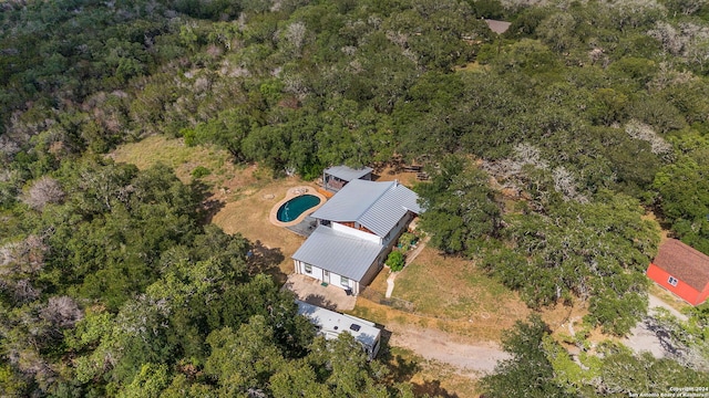 drone / aerial view featuring a view of trees