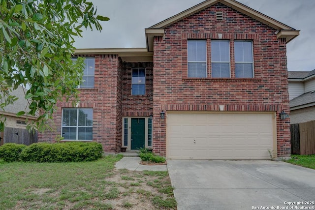 traditional-style home with concrete driveway, brick siding, a front yard, and a garage
