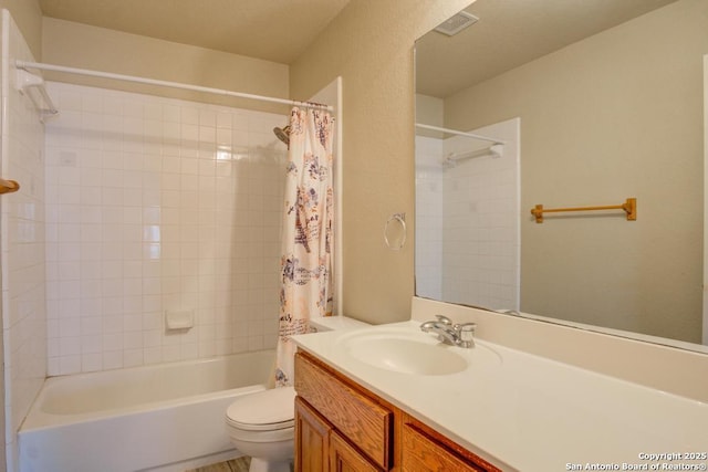 full bath with toilet, visible vents, shower / bath combo, and vanity