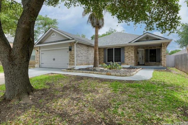 ranch-style home featuring fence, a shingled roof, brick siding, a garage, and concrete driveway