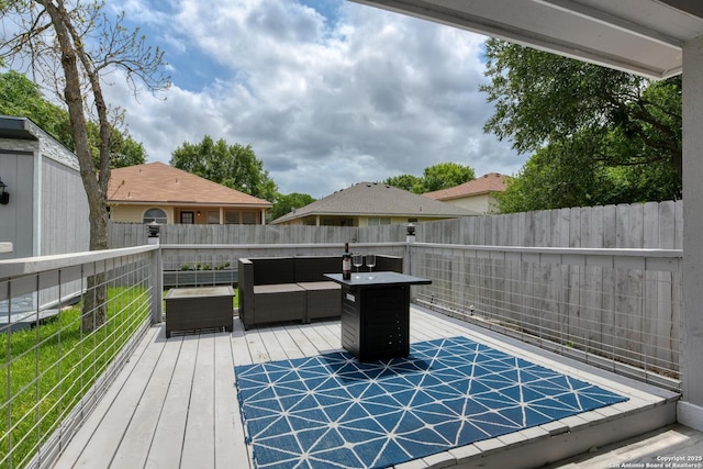 deck featuring fence and an outdoor living space