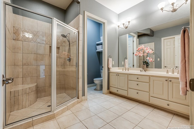 bathroom with a sink, tile patterned flooring, double vanity, toilet, and a stall shower