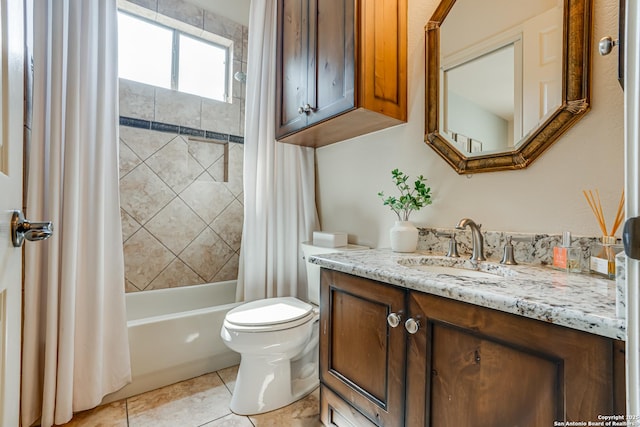 bathroom with toilet, shower / bath combo, and vanity