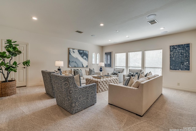 living room featuring recessed lighting, visible vents, and light carpet