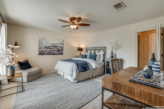 bedroom featuring baseboards, carpet, a ceiling fan, and visible vents