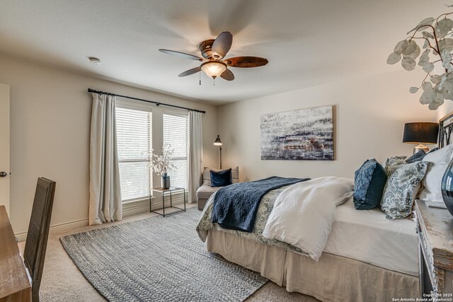 bedroom with carpet floors, baseboards, and ceiling fan