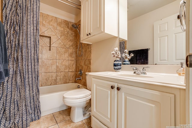 bathroom with toilet, tile patterned flooring, shower / tub combo with curtain, and vanity