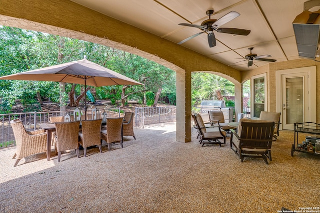view of patio / terrace with outdoor dining area, ceiling fan, fence, and area for grilling
