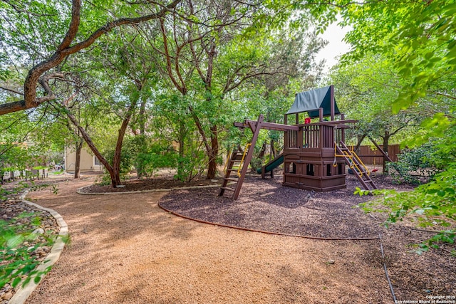 community jungle gym featuring fence