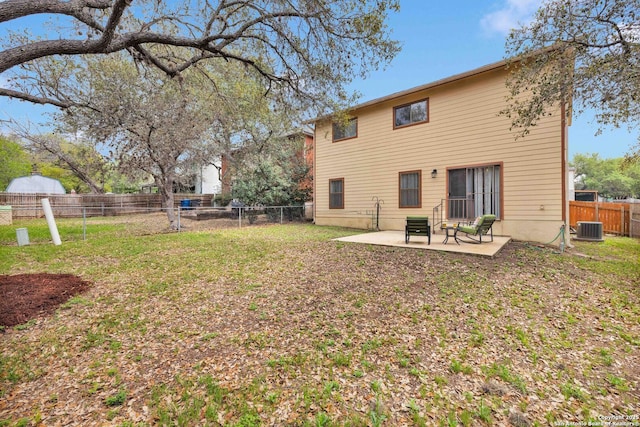 back of house with a yard, a patio, a fenced backyard, and central air condition unit