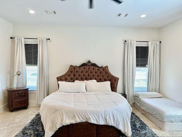 bedroom featuring multiple windows, recessed lighting, and visible vents