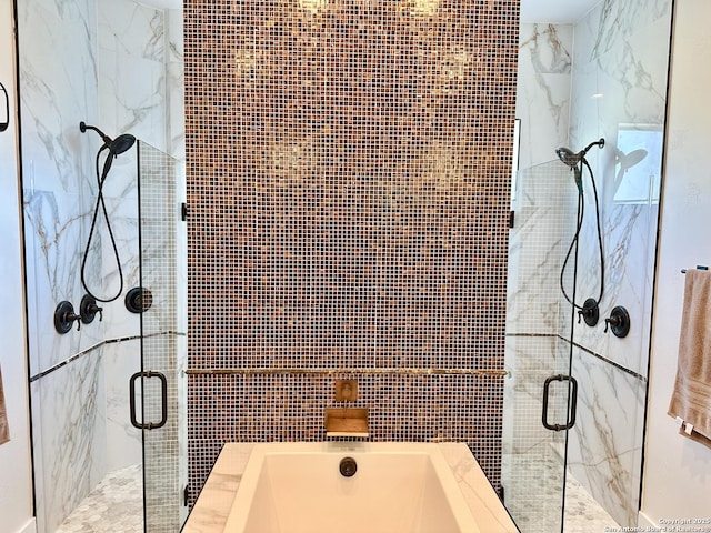 bathroom with a tub, tile walls, and a shower stall