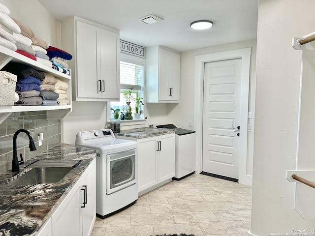 laundry room with a sink and cabinet space