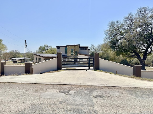 view of gate with fence