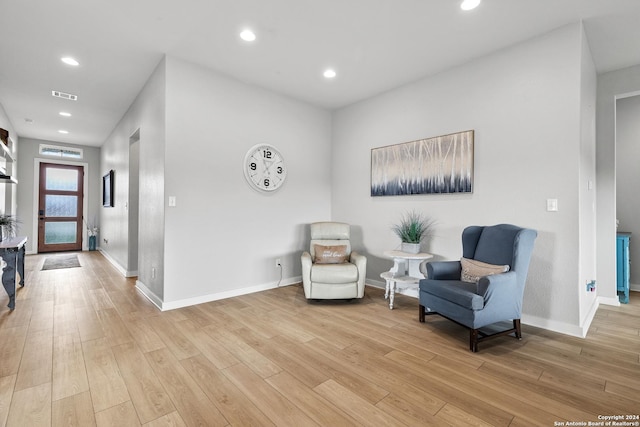 sitting room with visible vents, recessed lighting, light wood-style floors, and baseboards