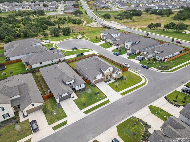 birds eye view of property with a residential view