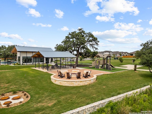 view of home's community with a lawn, a gazebo, and playground community
