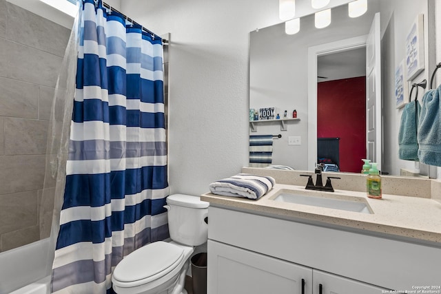ensuite bathroom with toilet, shower / bath combination with curtain, ensuite bathroom, and vanity