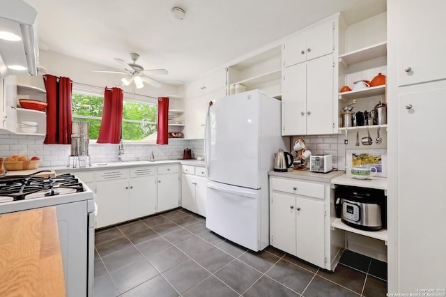kitchen featuring white appliances, a ceiling fan, open shelves, and decorative backsplash