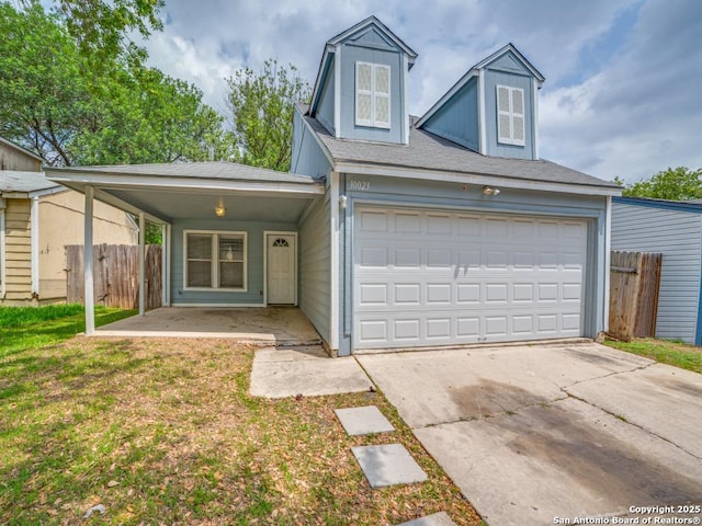 view of front of house featuring fence, an attached garage, driveway, and a front yard
