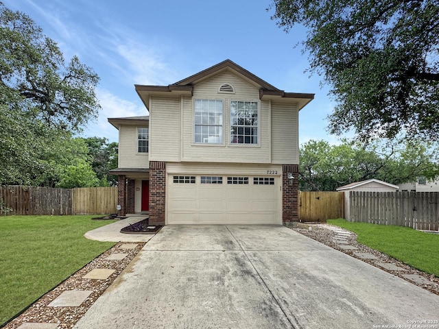 traditional-style home featuring driveway, a front yard, a garage, brick siding, and fence